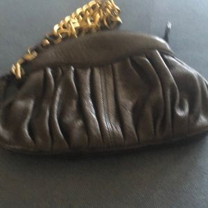 Linea Pelle brown clutch with a gold chain